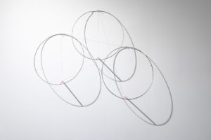 Felipe Dulzaides, Circular Fragility, 2011. Graphite, three metals rings, nail and pencil.