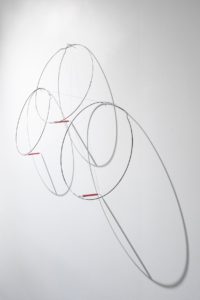Felipe Dulzaides, Circular Fragility, 2011. Graphite, three metals rings, nail and pencil.